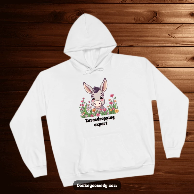 Funny donkey with notably high ears, curiously investigating a blooming flower patch, depicted on a comfortable and warm hoodie.