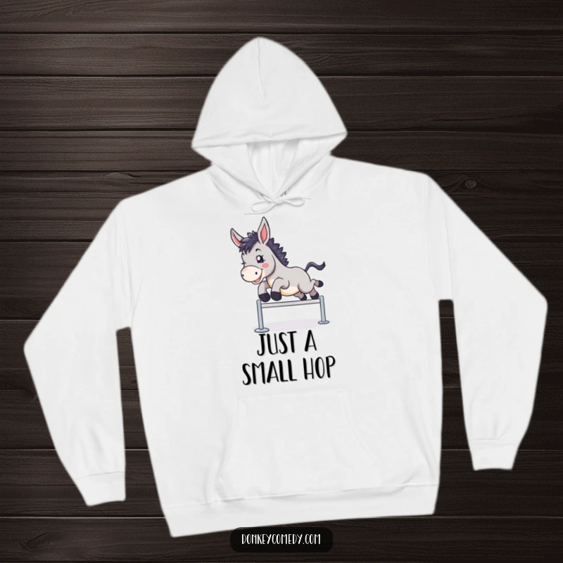 Funny hoodie featuring a donkey in mid-air, happily clearing a small hurdle, symbolizing achievement and joy.