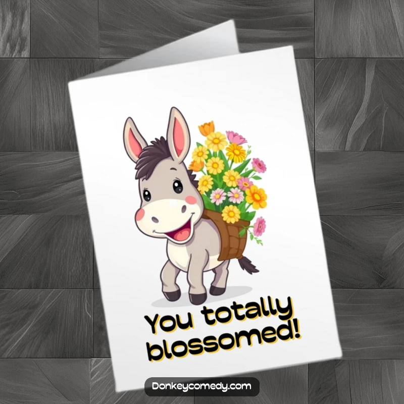 Funny free printable congratulations card showing a donkey with a wide, cheerful grin carrying a large load of colorful flowers.