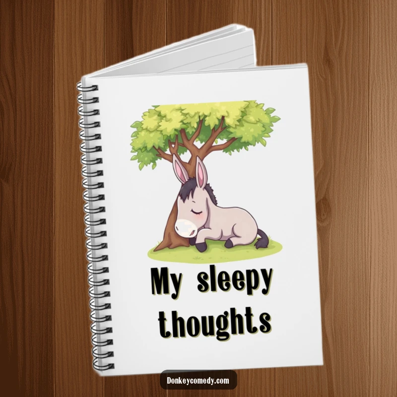 Funny sleepy donkey resting under a shady tree, on the cover of a notebook, a humorous stationery gift.