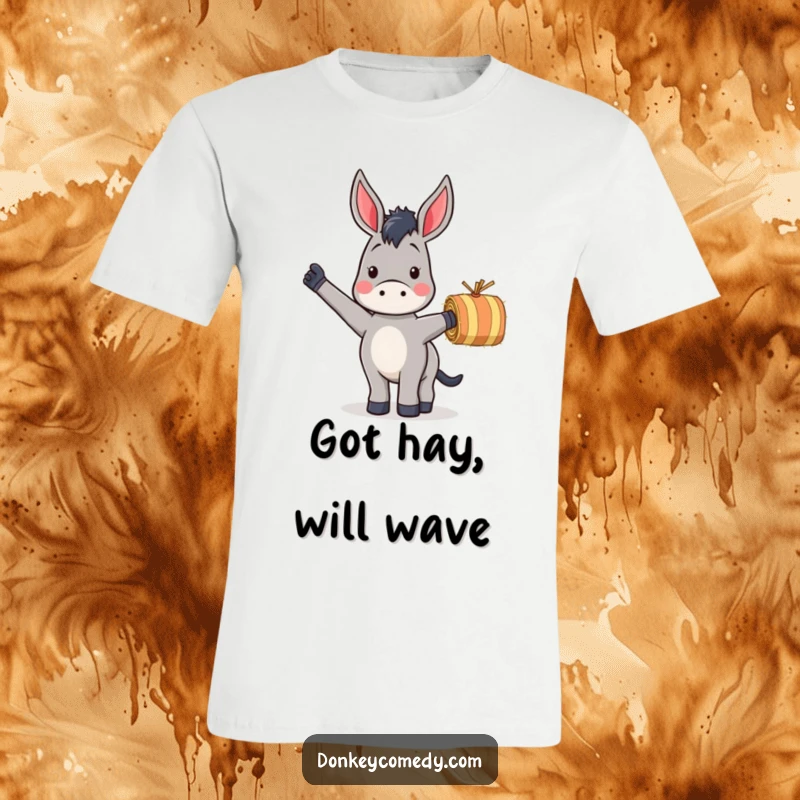 Funny t-shirt of a donkey enthusiastically waving a striped hay bale, celebrating farm life and humor.